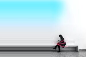 Woman sitting on bench reading a book