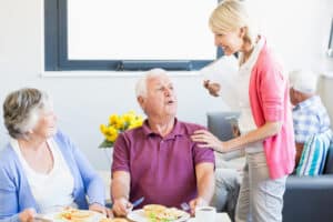 Dietician talking with elderly couple