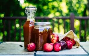 apples and jars of apple cider