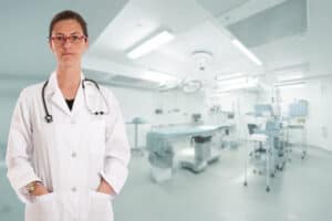 Image of female physician standing in operating room